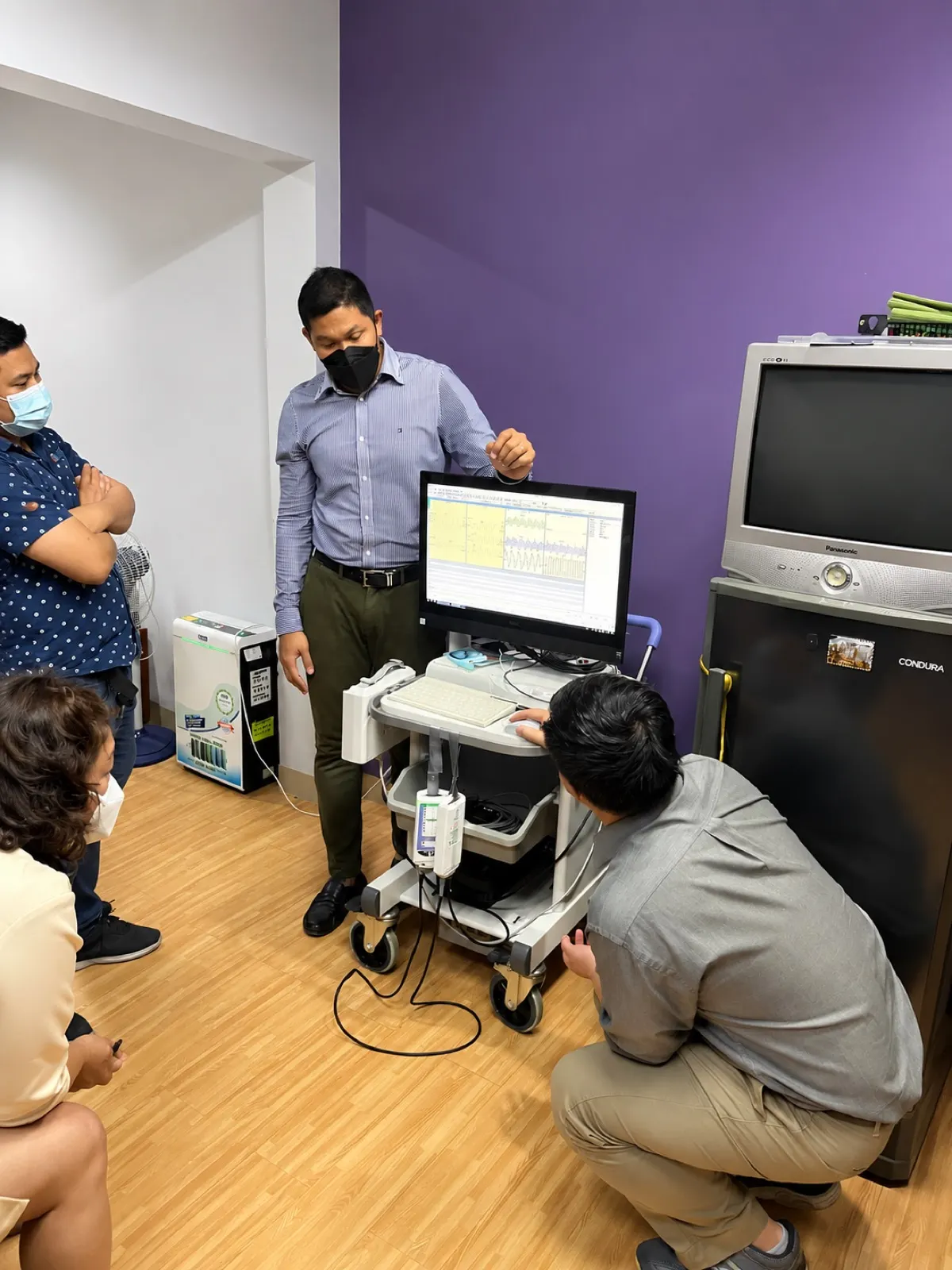 ICare Life technician installing and testing a diagnostic system on-site